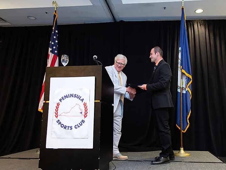 HRA alumnus Zack Caulford '25 receives a collegiate scholarship at the Peninsula Sports Club's 2025 Headliner's Night