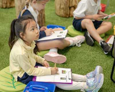 A Lower School student in the hydroponics laboratory at HRA